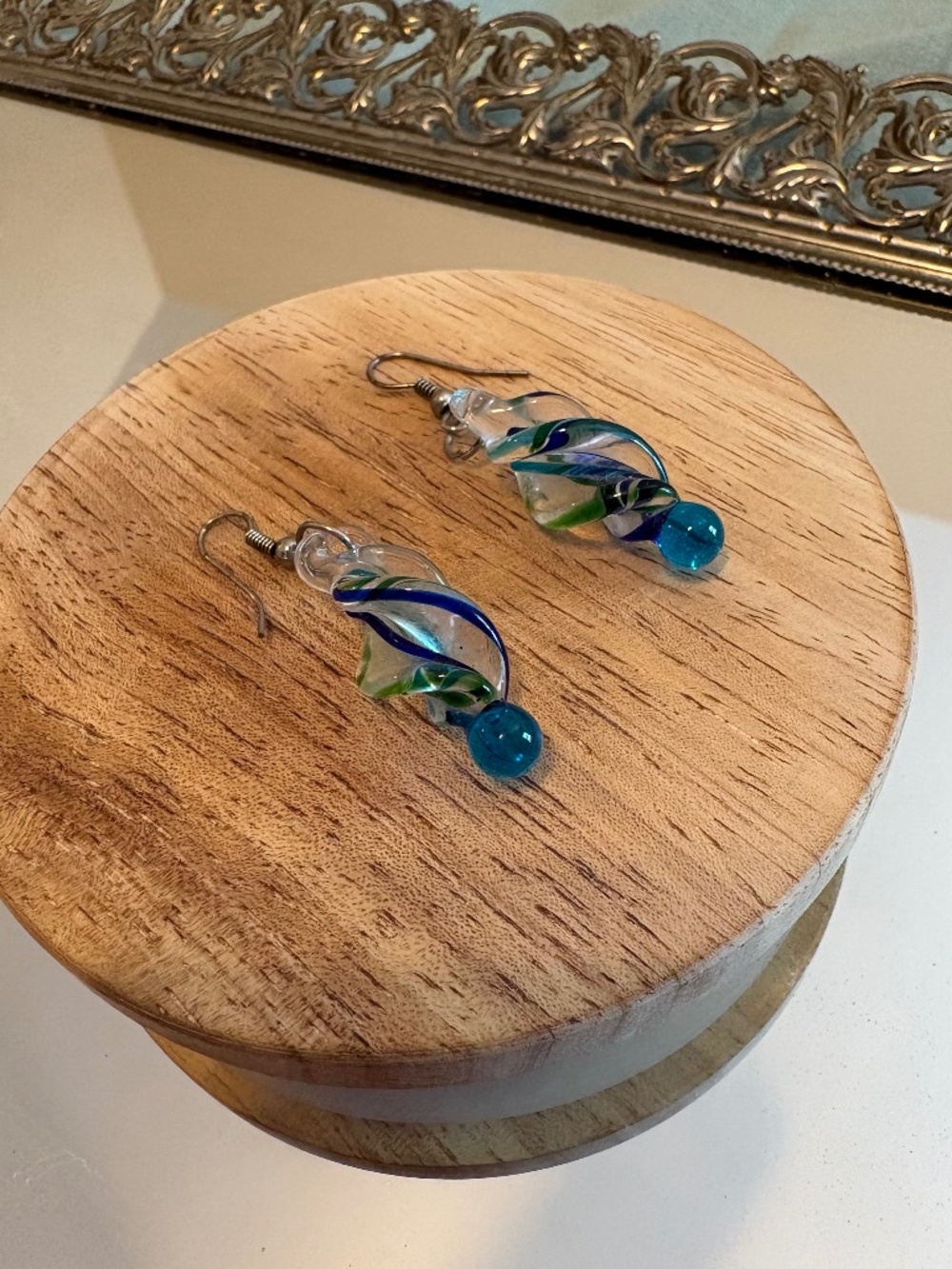 Blown glass earrings with blue and teal swirls